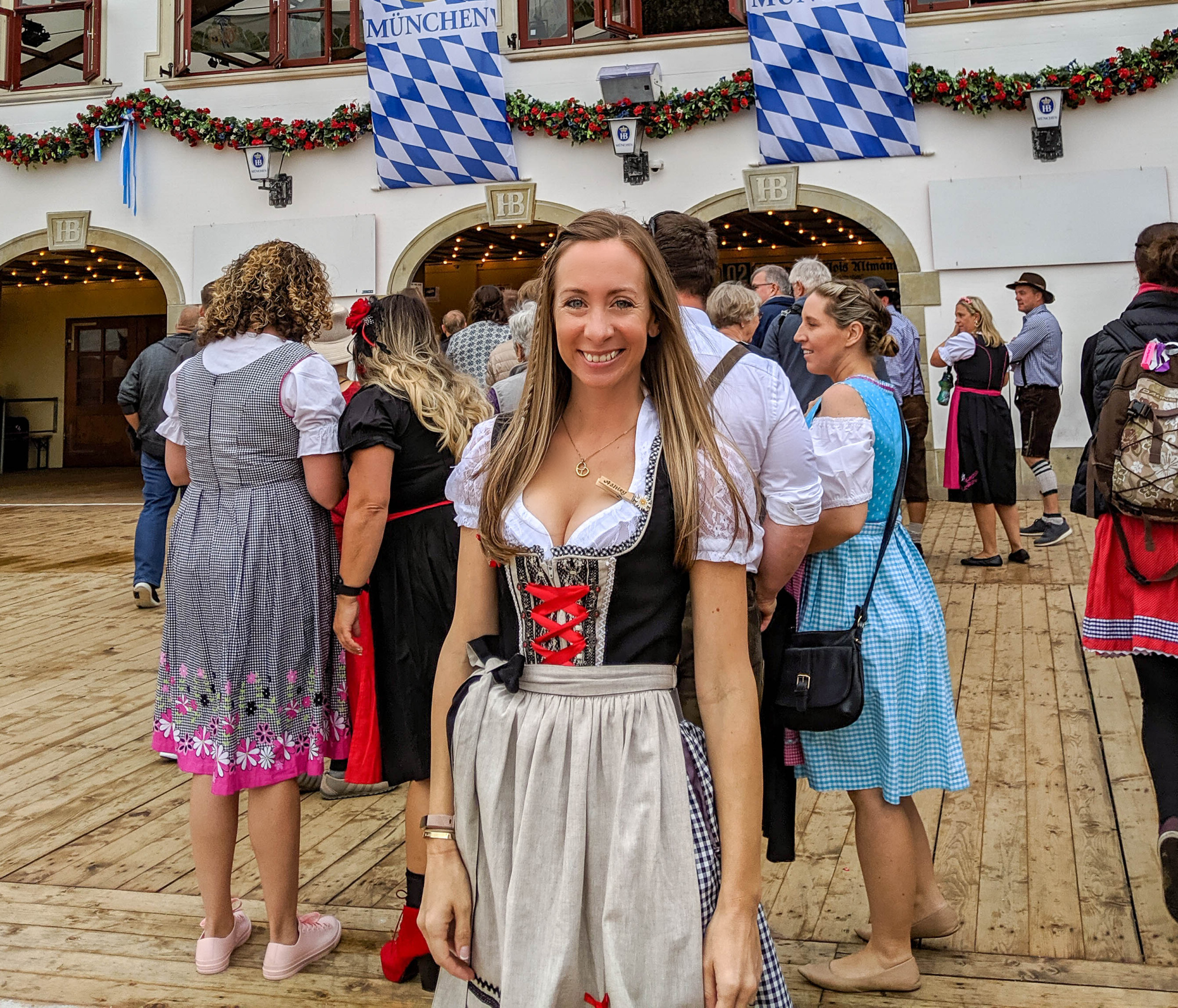 Attendees flaunting traditional Bavarian attire, embodying the spirit of Oktoberfest at Moss Bay Hall.